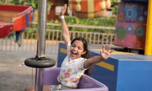Children enjoying the ride with full of fun entertainment in summer